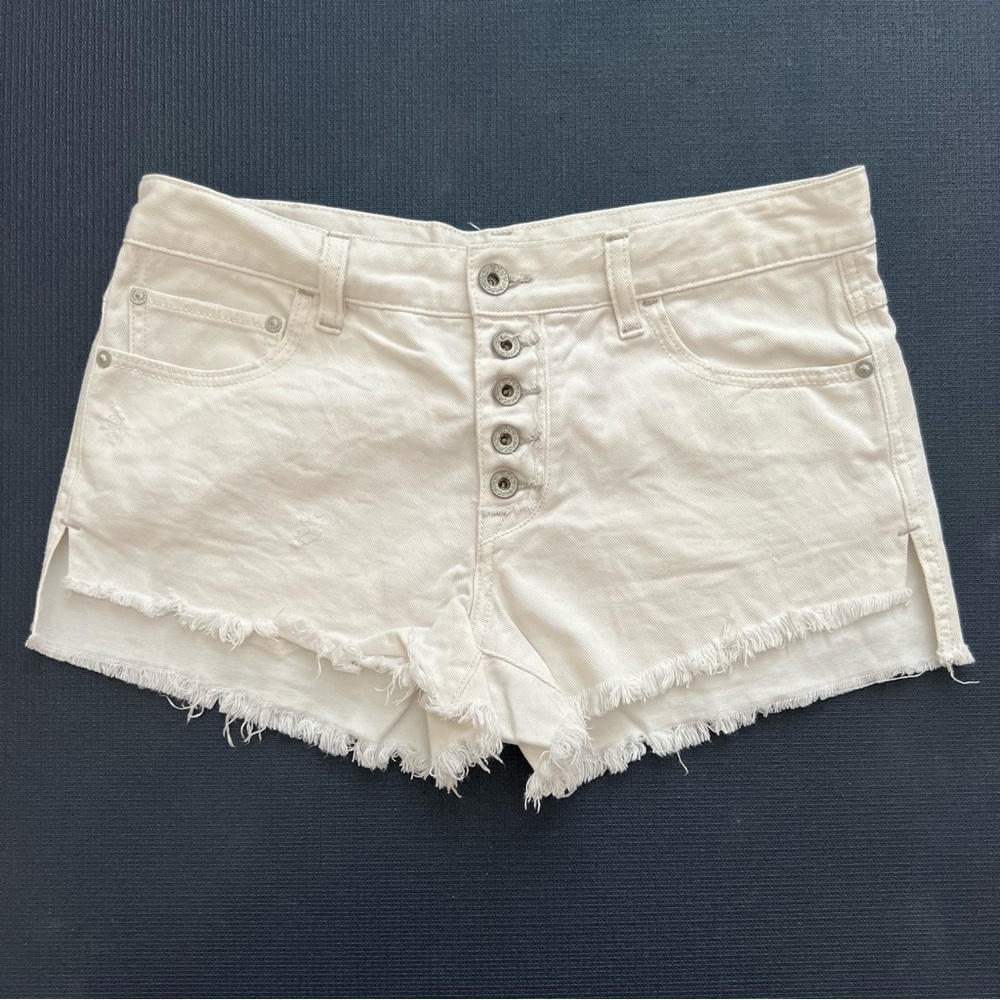 Free People white button fly shorts.